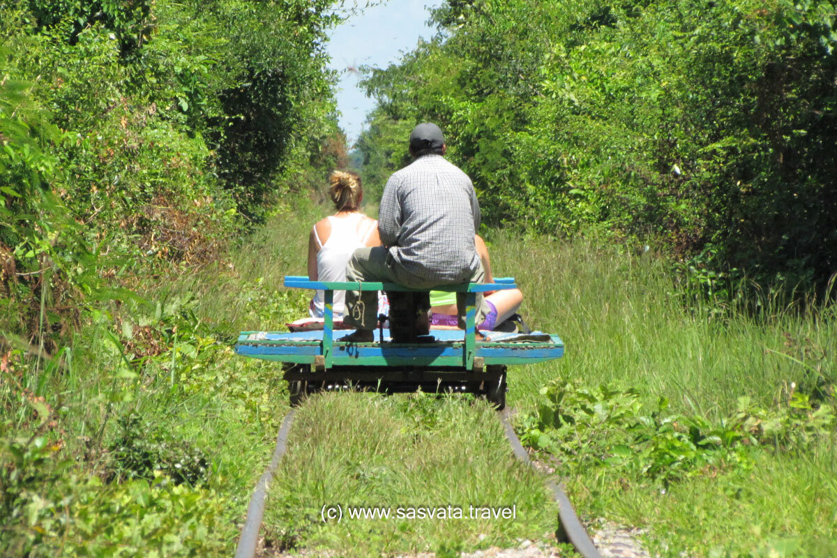 Bamboo train with tourists on abandoned railways in Battambang Cambodia